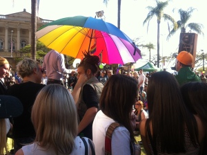 Woman holding rainbow umbrella. Source: James Just
